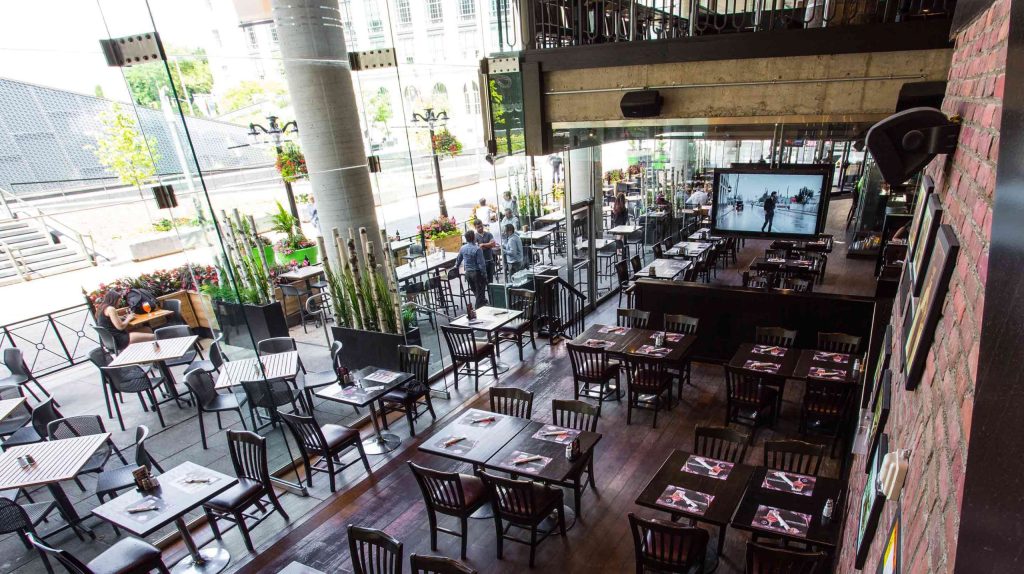 Bar with a big-screen TV for watching a game in Ottawa